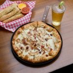 Greek's Pizzeria pizza, beer, and bread sticks